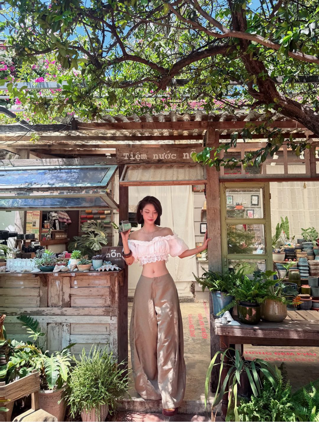 SalaChat host Nana from Vietnam at an outdoor cafe