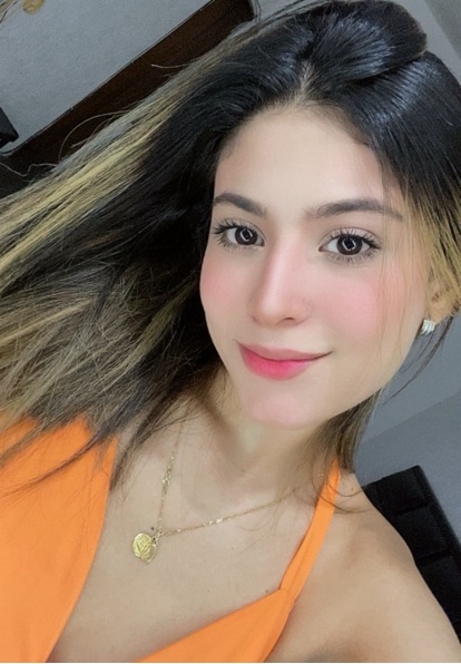 SalaChat host Sharon from Venezuela in an orange top